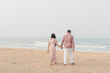 couple walking on the beach