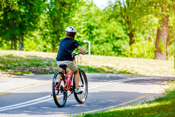 Cyclist ride on the bike path in the city Park
