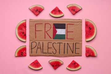 Carboard with text Free Palestine surrounding by watermelon fruits support to Palestinian on pink background - obrazy, fototapety, plakaty