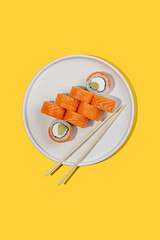 Maki Sushi with avocado inside and Salmon outside