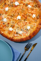 traditional Italian pizza with seafood on a colored background