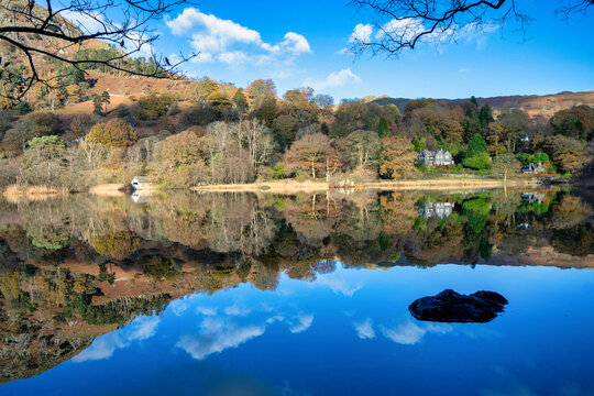 Magnificent scenery of Lake district national park with reflections on the water showing the beautiful colors of autumn. 