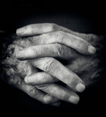 Old woman's hands worn by time.
