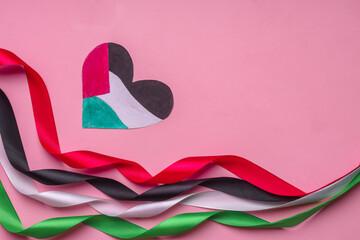Beauty of a heart shaped paper and colorful ribbons represents Palestine flag as symbol of...