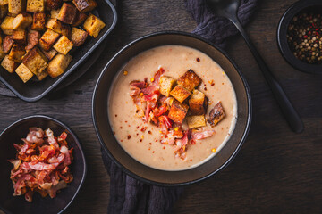 Homemade sweet chestnut soup with bacon and bread croutons