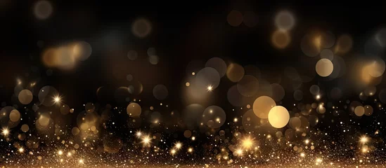 Fotobehang Festive background with golden particles on dark surface Abstract holiday backdrop Copy space image Place for adding text or design © Ilgun