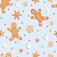 Fototapeta na wymiar seamless pattern of Christmas gingerbread and marshmallows on a blue background