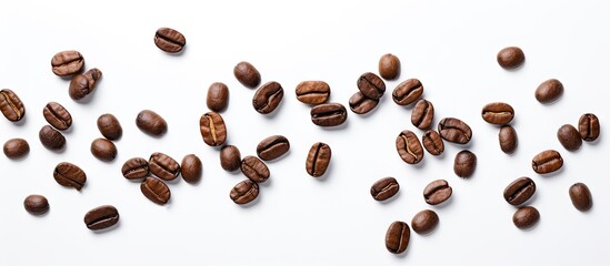 Obraz premium Coffee beans flying on a white backdrop Copy space image Place for adding text or design