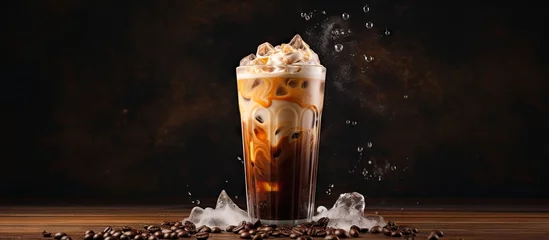 Rolgordijnen Cream is poured over iced coffee in a tall glass Copy space image Place for adding text or design © Ilgun