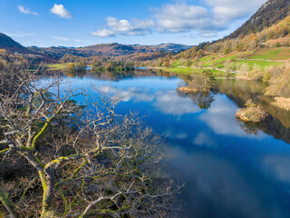 Naklejka premium Aerial image of Rydal water lake in the lake district national park, United kingdom on a beautiful autumn day. 