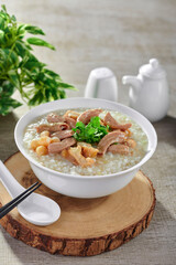 traditional chinese healthy braised porridge peanut congee rice seafood scallop fish century egg...