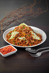 traditional chinese wok egg pineapple fried rice chicken floss xo sauce vegetable in plate on grey vintage background cafe hotel luxury halal food restaurant banquet menu