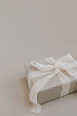Christmas, New Year composition. Handmade winter holidays gift box with bows and ribbons. Festive packaging concept