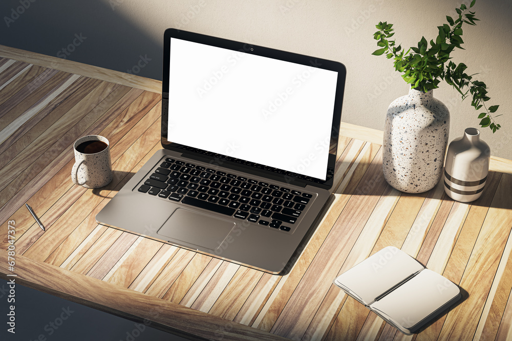 Poster close up of clean designer desktop with empty laptop screen, coffee cup, supplies and other items on