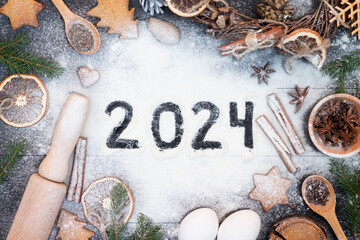Happy New Year 2024 written on flour. Christmas, New Year greeting card