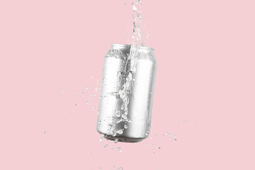 Aluminium beer or soda drinking can with water splash on light pink background