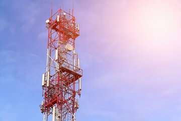 5g tower mast with radio modules on a city skyline, providing telecommunication services with 4g...