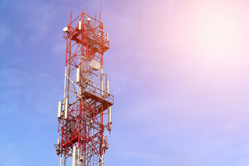 5g tower mast with radio modules on a city skyline, providing telecommunication services with 4g and 5g cellular networks and macro base stations.