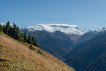Foggy and snowy mountain landscape. Mountains covered with fog and clouds. Snow-capped hills. Snow-covered forest landscape. Black Sea mountains. Pokut Plateau. Kackar Mountains. Rize, Türkiye.
