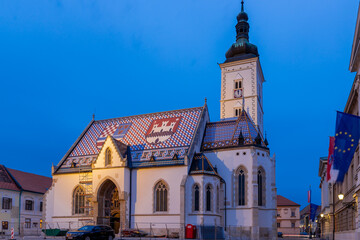 Obraz premium Zagreb, Croatia 10-9-2023 St. Mark is the parish church of old Zagreb, located in St. Mark's square and the oldest architectural monument in town, the roof tiles are the coat of arms of Croatia
