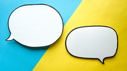 Speech bubbles on a blue and yellow background. Comic clouds with a place for text
