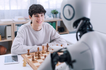 Fun and games: boy matches wits with robot