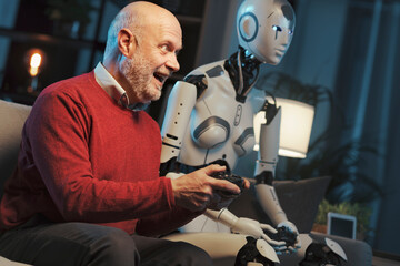 Man and humanoid robot playing video games together
