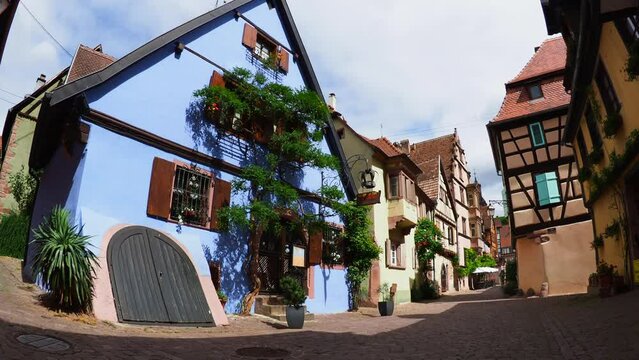 Moving through the colorful half timbered building in the streets of the beautiful Alsace village Riquewihr