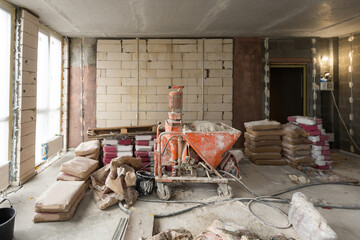 A specialized mixer for mixing dry plaster with water and automatically feeding the finished plaster.