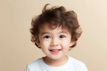 Naklejka premium Adorable Asian toddler with a bright smile,