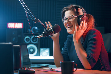 Smiling DJ hosting a radio show