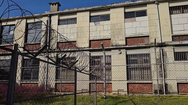 Korean Iksan Old Prison Yard. Prison Barbed Wire Fence and Jail Building Facade, no People Panning