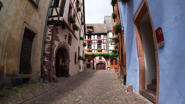 Moving through the colorful half timbered building in the streets of the beautiful Alsace village Riquewihr
