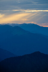 Rays of sunlight reflected from the clouds to the mountains.Rays of sunlight reflected from the clouds to the mountains. Sunset Colorful images in the mountains. View of Kackar mountains from Huser P