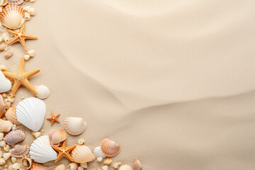 Top view of a sandy beach with various seashells and starfish on one side, copy space. Vacation, holiday background. Empty space for text, advertising. Travel, relax.