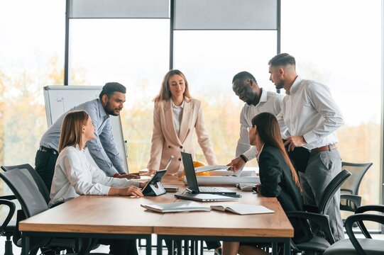Team are busy and bringing the ideas for project. Group of office workers are together indoors