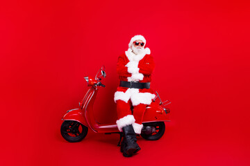 Full size photo of eccentric aged santa claus folded hands sit bike new year festive event isolated...
