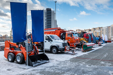 Exhibition of snow removal equipment on a clear winter day