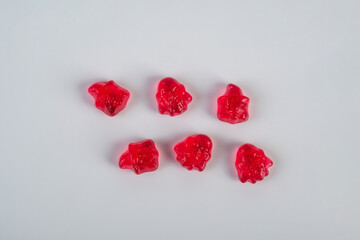 Colorful Fruity Gummy Worm Candy on white background.