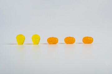 Colorful Fruity Gummy Worm Candy on white background.