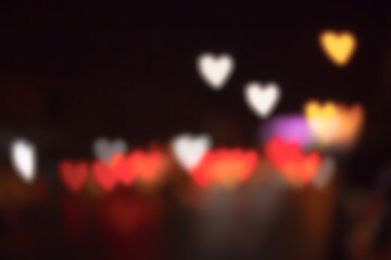 blurred heart shaped bokeh night light .Defocused light background .