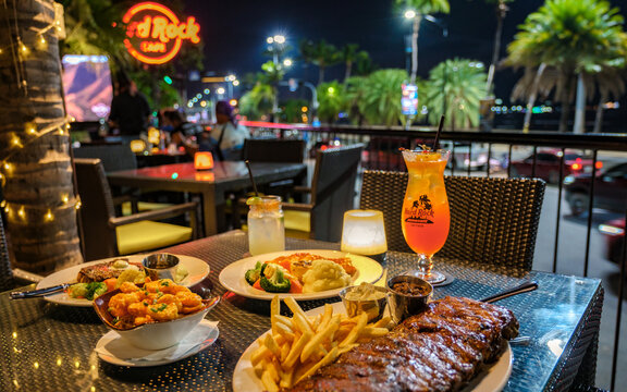 Pattaya Thailand 10 November 2023, Hard rock cafe and Hotel on the Beach Road, dinner table in the evening