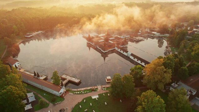 Thermal Lake Heviz at sunrise in Hungary, aerial view