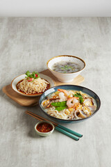 traditional chinese set seafood fried putian noodle with dumpling dim sum bao and soup snack vegetable in plate on grey vintage background cafe hotel luxury halal food restaurant banquet menu