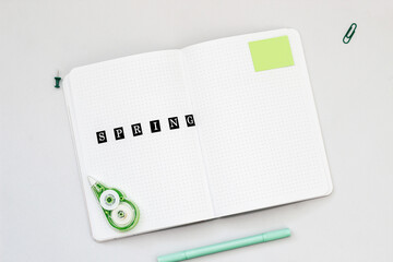 Filling in the diary, the inscription Spring in the notebook in a dot