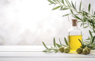 Gardinen Bottle olive oil and olive branches on white wooden table over light kitchen background © Nate
