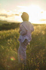 Image of a happy senior woman enjoying a day in nature, reflecting the high quality of life in...