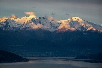 incredible sunset of the snowy mountains of lake di como in italy