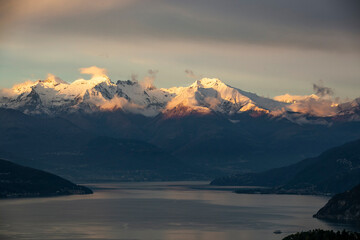 incredible sunset of the snowy mountains of lake di como in italy