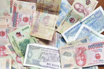 Vietnamese dong banknotes close-up. Money background. Vietnamese currency - dongs. Pattern texture and background of Vietnam dong money. 